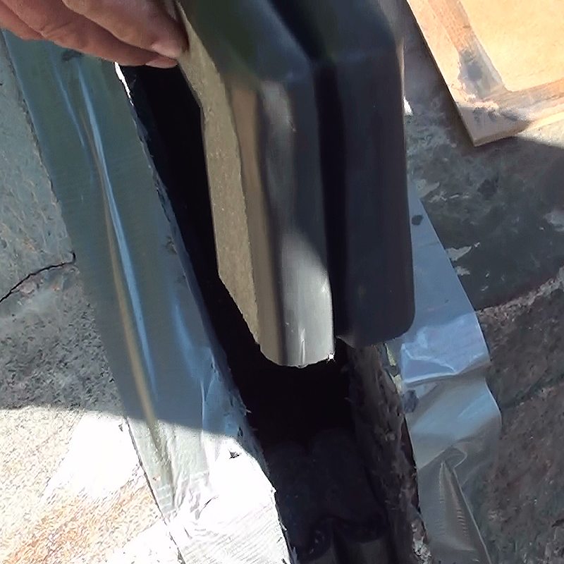 Bridge expansion joint transitions for curbs, sidewalks, parapets