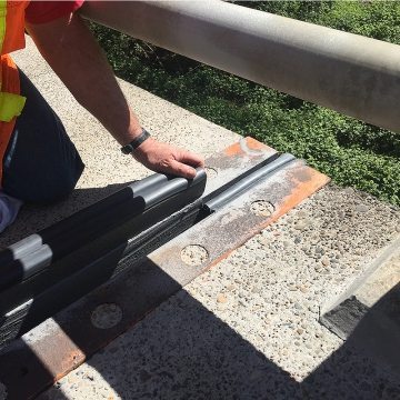 Installing a straight length of BEJS to already installed Kickout Termination at edge of bridge deck.