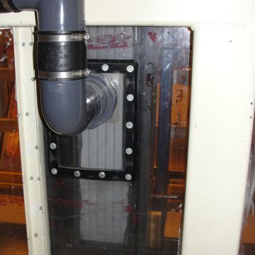 Test pressure chamber showing pressure/vacuum pipe and WFR2 at max joint opening (7/12"). During ASTM E-331, a vacuum is pulled on the airspace in front of the material while water is sprayed from behind. The material showed no leaks. In ASTM E-330, the air space is both evacuated and pressurized and deflection of the samples is measured on the back side. In all cases the deflection measure was so small as to be within the margin of error of the instrumentation. This means that at both negative and positive pressures beyond hurricane strength, the WFR2 expansion joint sealant does not deflect.