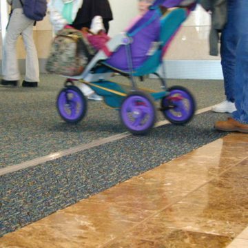 Expansion joint covers Migutrans FS 75 handles stroller traffic at Orlando Airport Southwest terminal.