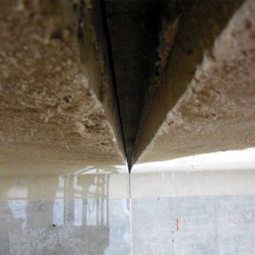 Once the fireproofing was properly cured, the polystyrene forms were removed leaving a joint gap in the fireproofing equal in width to the joint in concrete tunnel roof.