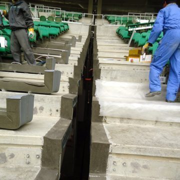 Forms removed. EMCRETE-filled blockouts on treads and risers. NOTE: on treads to the left of the joint, the factory-fabricated, precompressed tread/riser units are laid out based on the supply plan.