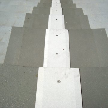 This is a view looking down the completed installation of the SJS SYSTEM in the seating bowl. The sandblasted coverplates are skid resistant and feature a long chamfer on its edges to facilitate pedestrian traffic.