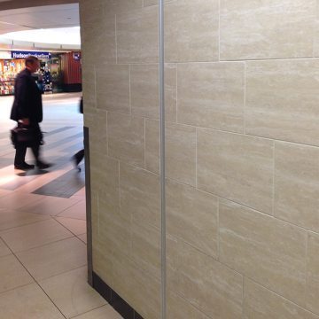 Migutrans FS 50 wall expansion joint installed with tile at Nashville International Airport
