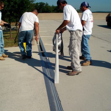DSM SYSTEM Installation into Concrete Expansion Joints removing duct tape