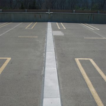 Nearly three years after installation the system remains unchanged. The factory fabricated transitions over curbs and into parapets, as well as the field-fabricated transitions over the parapets in the SEISMIC COLORSEAL remain watertight ensuring continuity of seal.