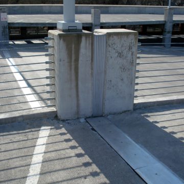 SJS SYSTEM with watertight transition to SEISMIC COLORSEAL in split columns at University of Tennessee 11th St Parking Garage.