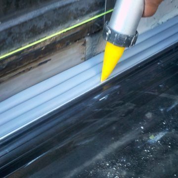 Plaza deck expansion joint sealing: DSM-FP in plaza to wall expansion joint injecting sealant band 2 Houston Center EMSEAL