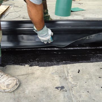 DSM-FP in plaza to wall expansion joint embedding side sheet 2 Houston Center EMSEAL