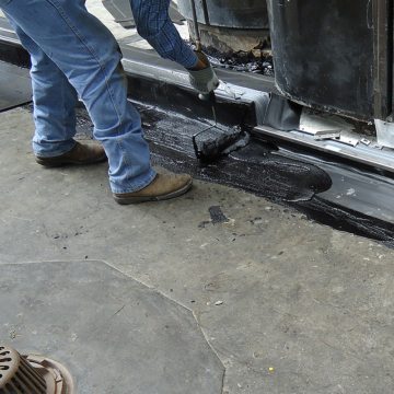 DSM-FP in plaza to wall expansion joint top coat hot rubberized asphalt 2 Houston Center EMSEAL