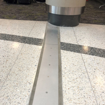 Airport Concourse SJS Floor Expansion Joint Cover Column Transition at BNA Nashville International Airport by Sika Emseal