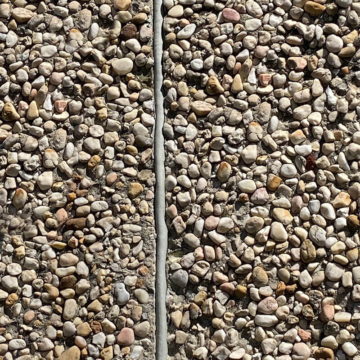 SafeReseal - A Retrofit Joint Sealant System for EIFS, Precast, Concrete, and virtually any substrate that is a safer, grindless, dustless, primerless, tensionless, paintable Joint Sealing System. Here the system is installed in an exposed aggregate concrete Façade.