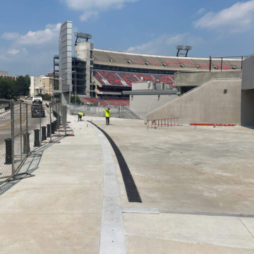 Curved seismic expansion joint coverplate system on stadium concourse at Sanford Stadium at UGA by Sika Emseal