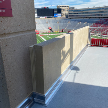 Stadium parapet wall expansion joint features Seismic Colorseal from Sika Emseal