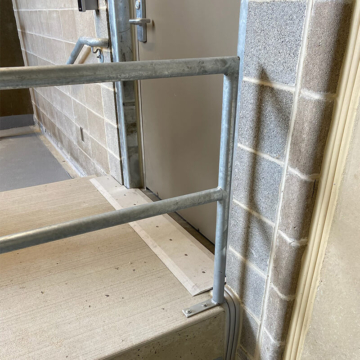 Doorway expansion joints with transition to deck-to-wall and further transition to wall joint. Sika Emseal SJS, DSM, and Seismic Colorseal