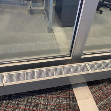 Transition from interior floor expansion joint to exterior stadium concourse expansion joint using SJS from Sika Emseal
