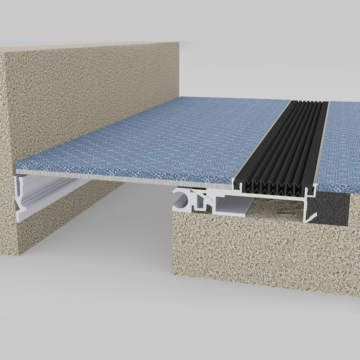 Wabo®SeisMaxPlus NBS interior floor to wall seismic recessed flush expansion joint cover plate system with carpet flooring inserted by Sika Emseal