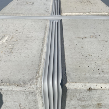 Airport expansion joint parking deck cross transition with precompressed foam sealant Horizontal Colorseal by Sika Emseal