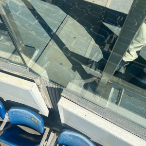 Vertical expansion joint transitioning from seating bowl to concourse.