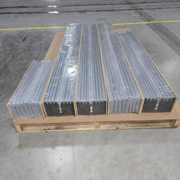 SJS seismic expansion joint system shrink‑wrapped on a pallet, prepared for transport to the SFMTA project site. The packaging protects the ADA‑compliant joint system during shipping and staging.