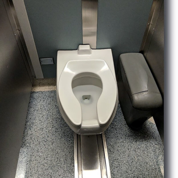 Chicago O'Hare International Airport bathroom stall with expansion joint designed under and around toilet