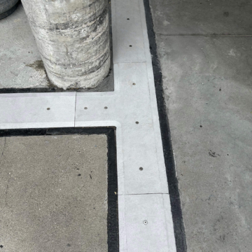 90-degree tee transition with custom-fabricated coverplate at column intersection, SJS-FR2 fire-rated seismic expansion joint, IKEA Palo Alto