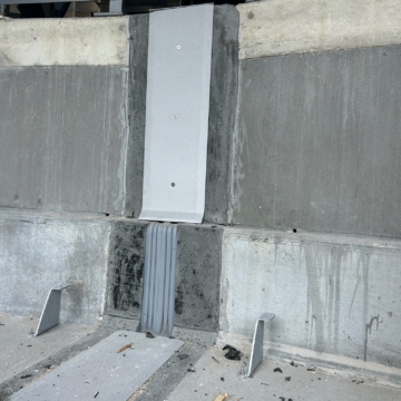 Expansion joint terminating at the parapet wall at Ryan Field, showing the seal carried from the concrete deck up through the wall condition.